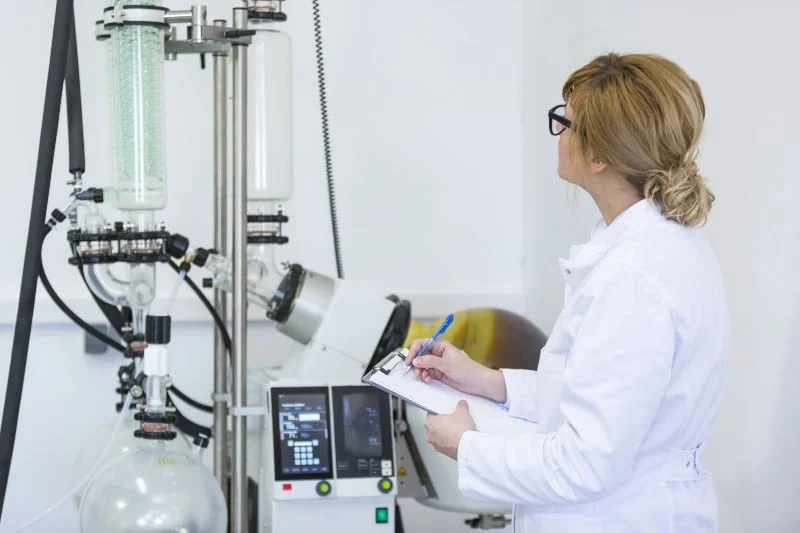 female scientist manufacturing delta 8 in a lab